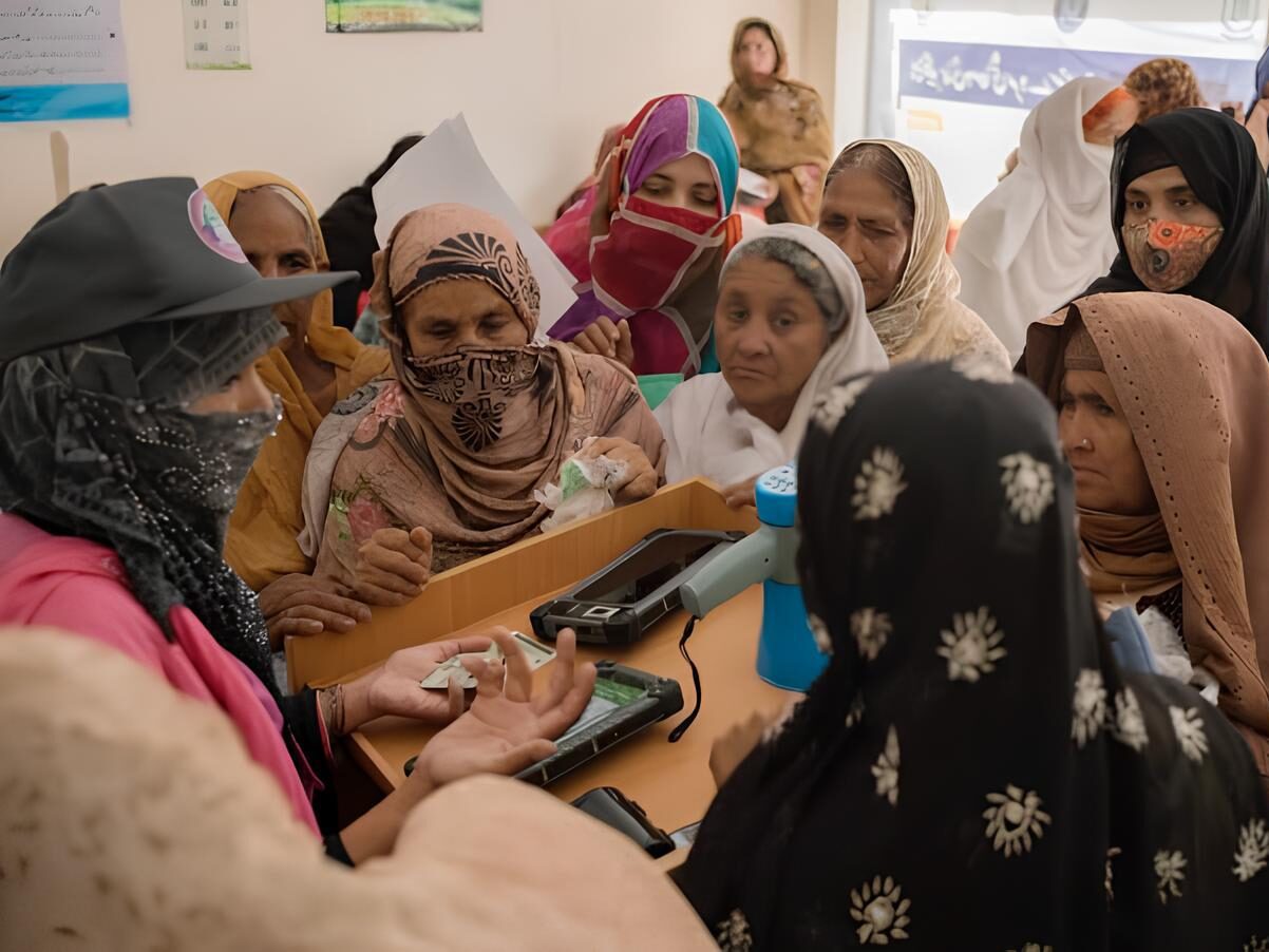 A BISP Tehsil Office in Pakistan with women waiting in line.